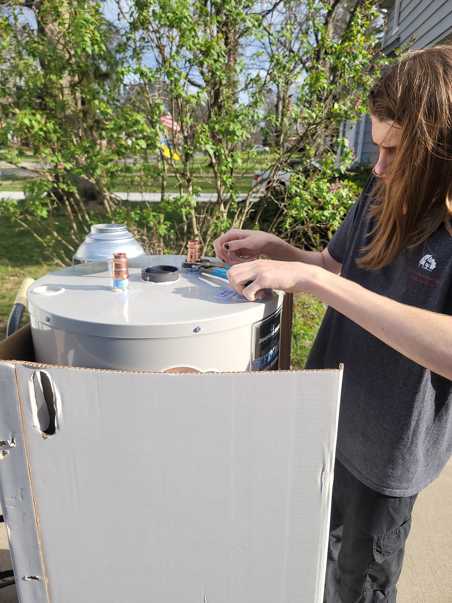 Handyman working on a water heater system